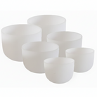 Set of six white singing bowls on a white background.