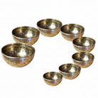 Set of 8 Himalayan singing bowls on a white background