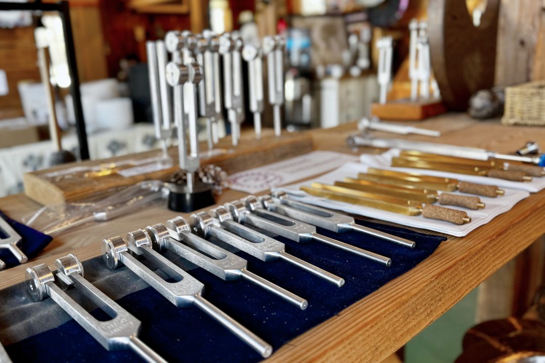 Set of tuning forks on a wooden surface in the Sunreed retail store